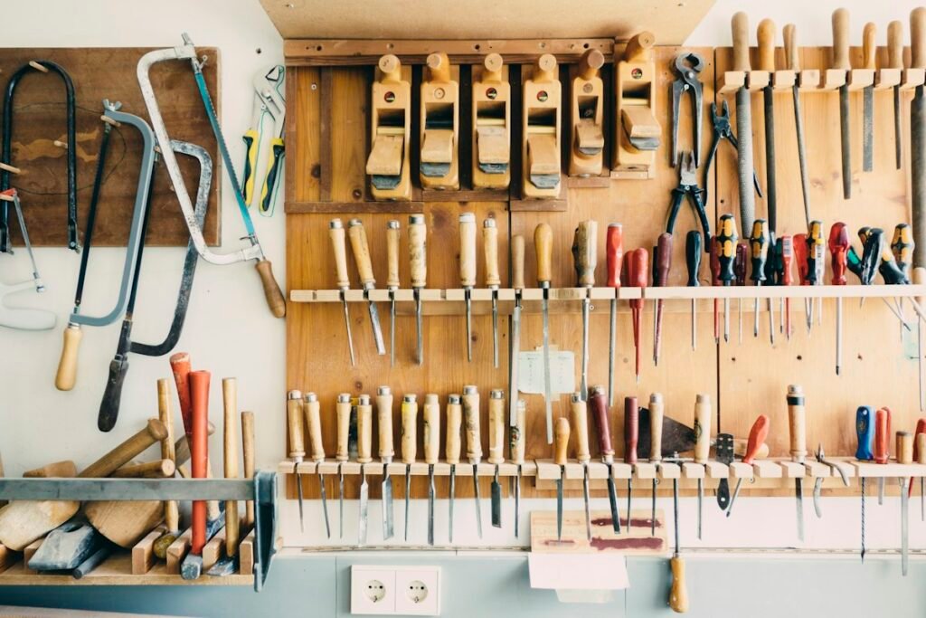 Assorted hand tools arranged on a workshop rack; generic editorial illustration, not a GEARWRENCH product photograph