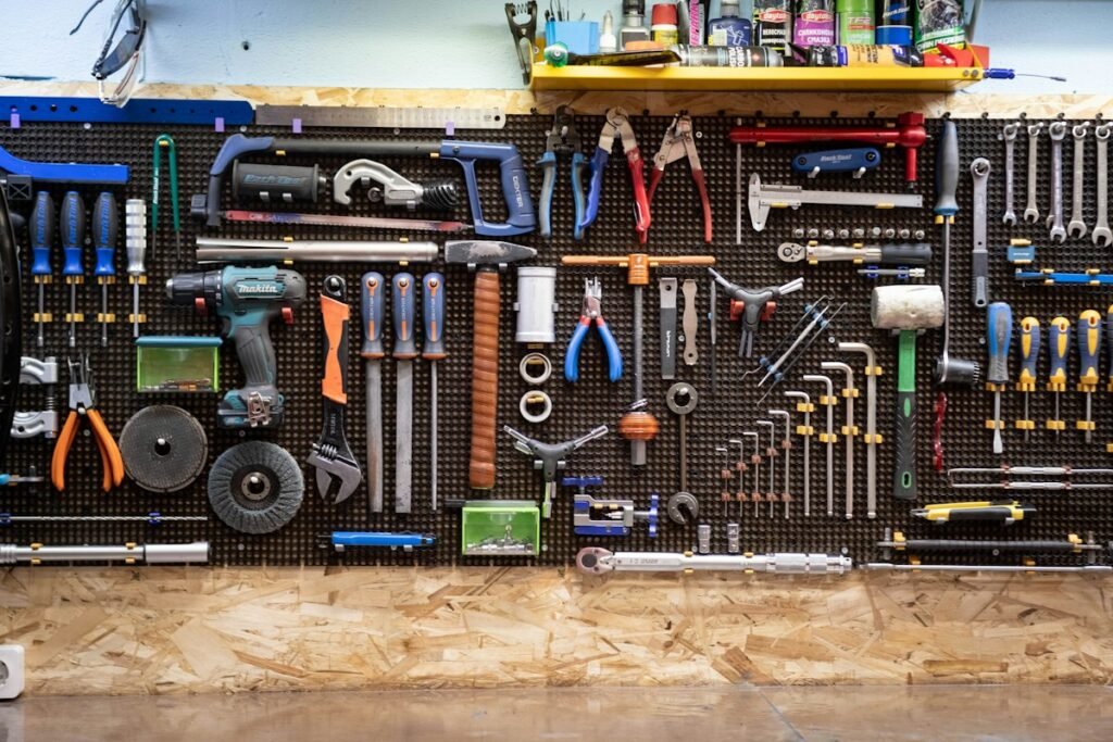 Hand tools hanging on a workshop wall